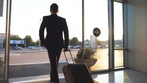 Unrecognizable,Man,Walking,Through,Glass,Automatic,Door,Of,Modern,Airport cheap parking near me