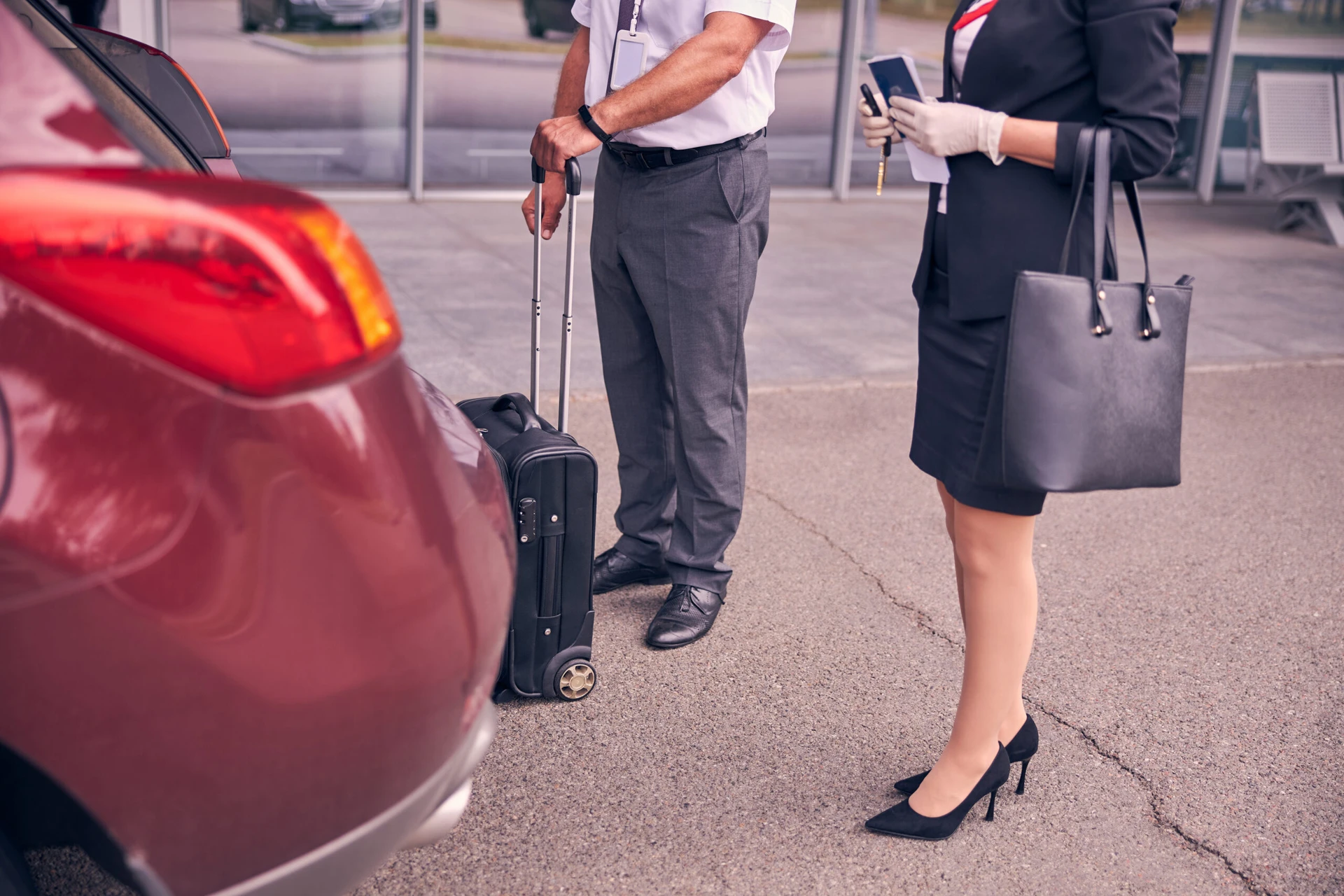 Close,Up,Of,Gentleman,Holding,Travel,Suitcase,While,Standing,Beside MCI Valet Parking